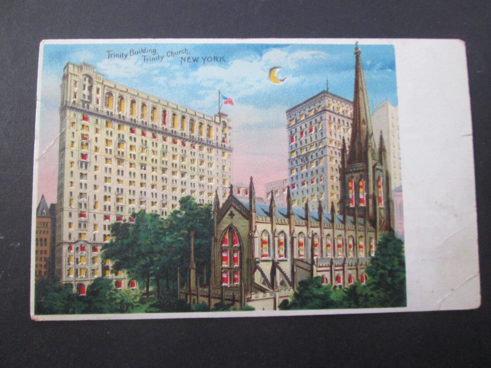 Hold to light postcard Trinity bldg NYC