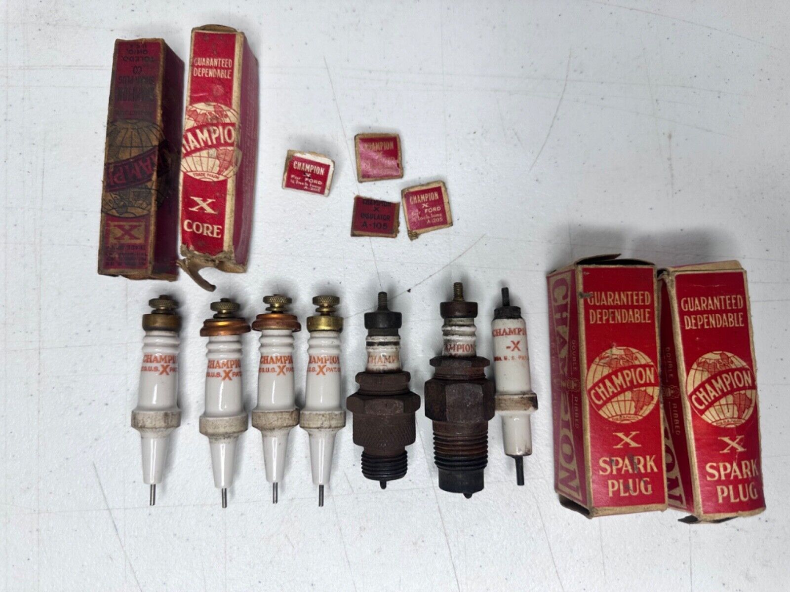 Antique Champion Spark Plugs for Classic Ford Cars - Collectible Automotive Part