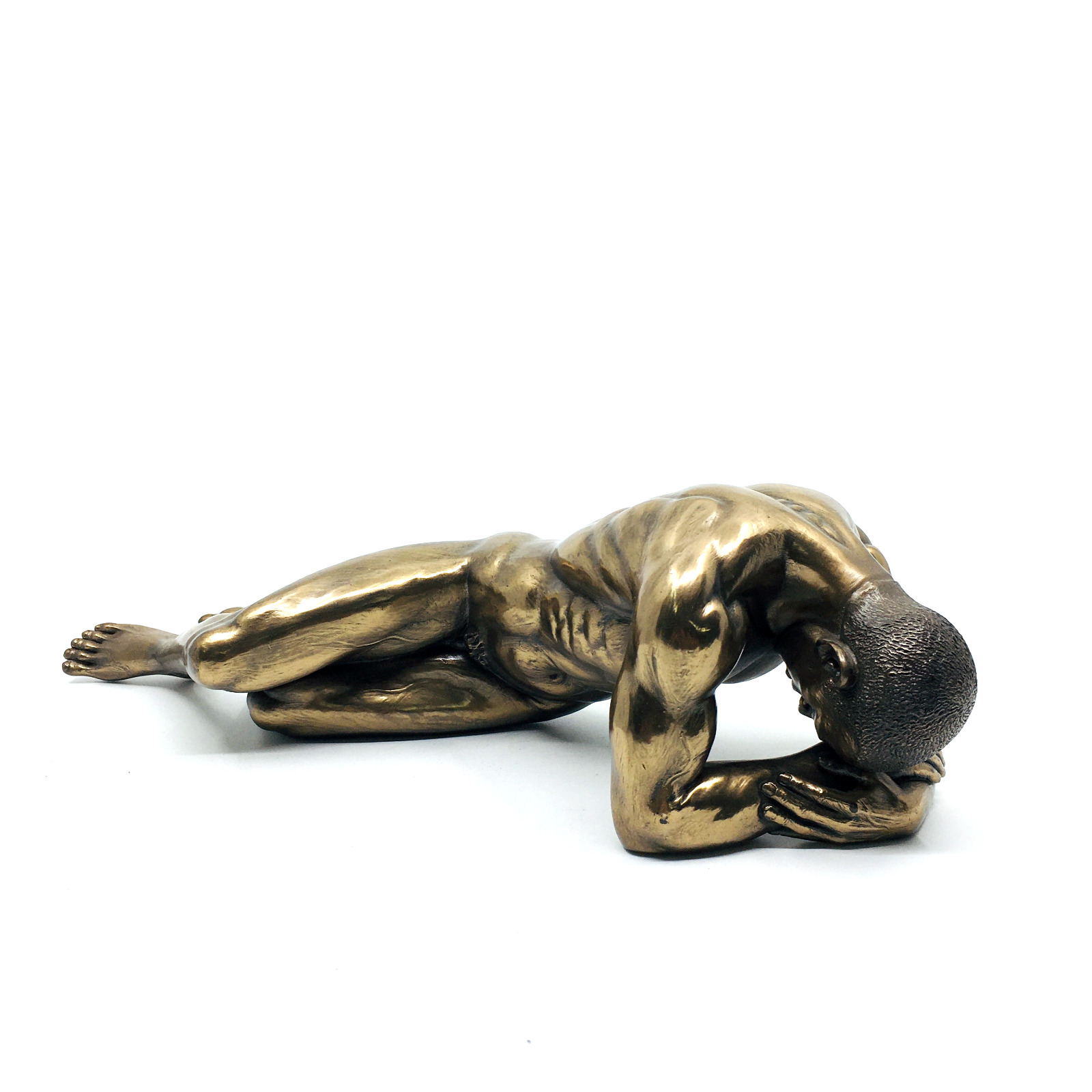 Muscular Naked Male Figurine Lying Facedown on the Ground