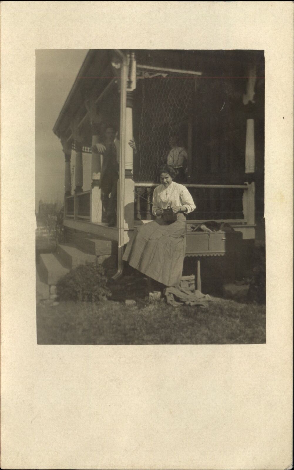 RPPC Woman waiting for her beau ~ Pa lookin\' on ~ 1904-1918 photo postcard