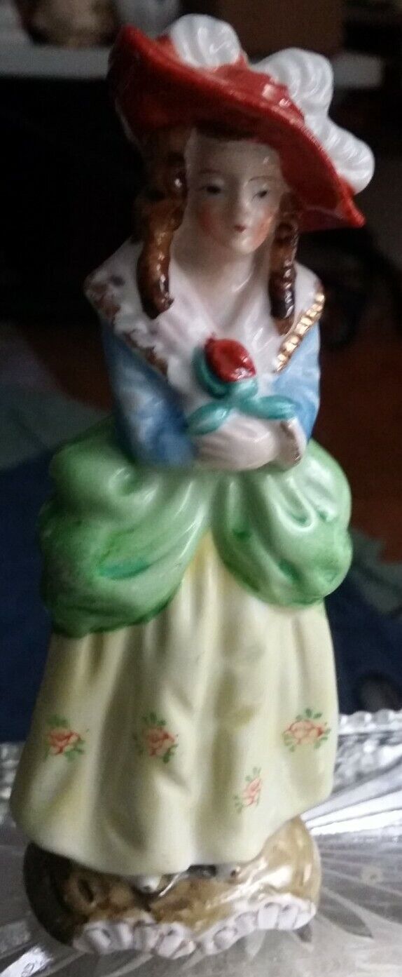 Vintage 18th/19th century WOMAN IN GREEN, YELLOW, BLUE W FLOWER ceramic figurine
