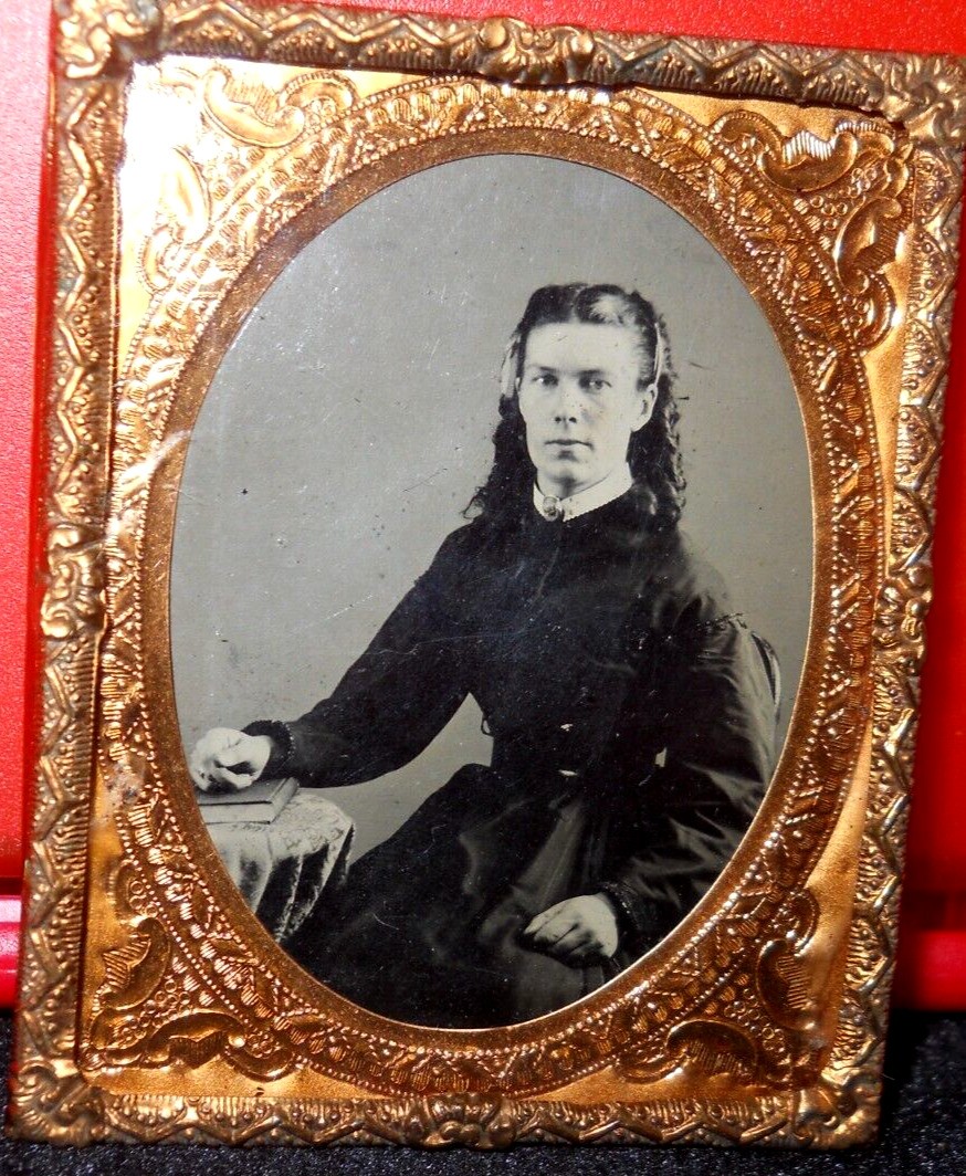 1/9th Size Tintype of young lady in brass mat/frame