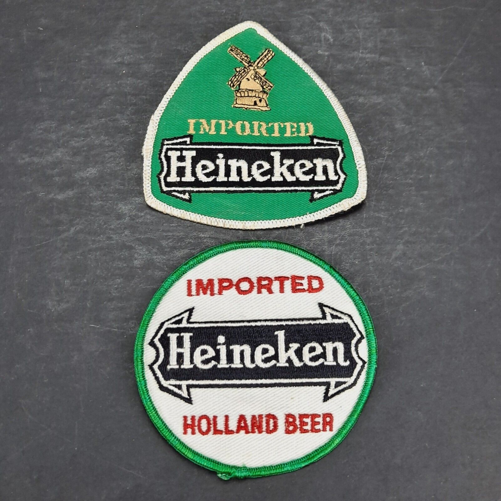 TWO VINTAGE IMPORTED HEINEKEN BEER EMBOIDERED CLOTH DISTRIBUTOR PATCHES