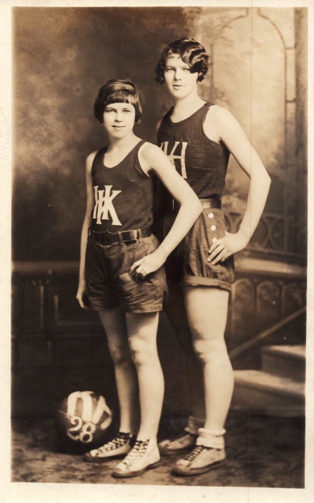 Two Women Basketball Players Pose with Ball on Floor Vintage RPPC Postcard