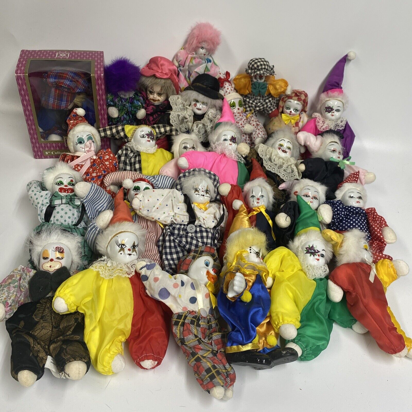 Lot Of 27 Clown Dolls w/ Porcelain Head Painted Face Fabric Sand Filled Body