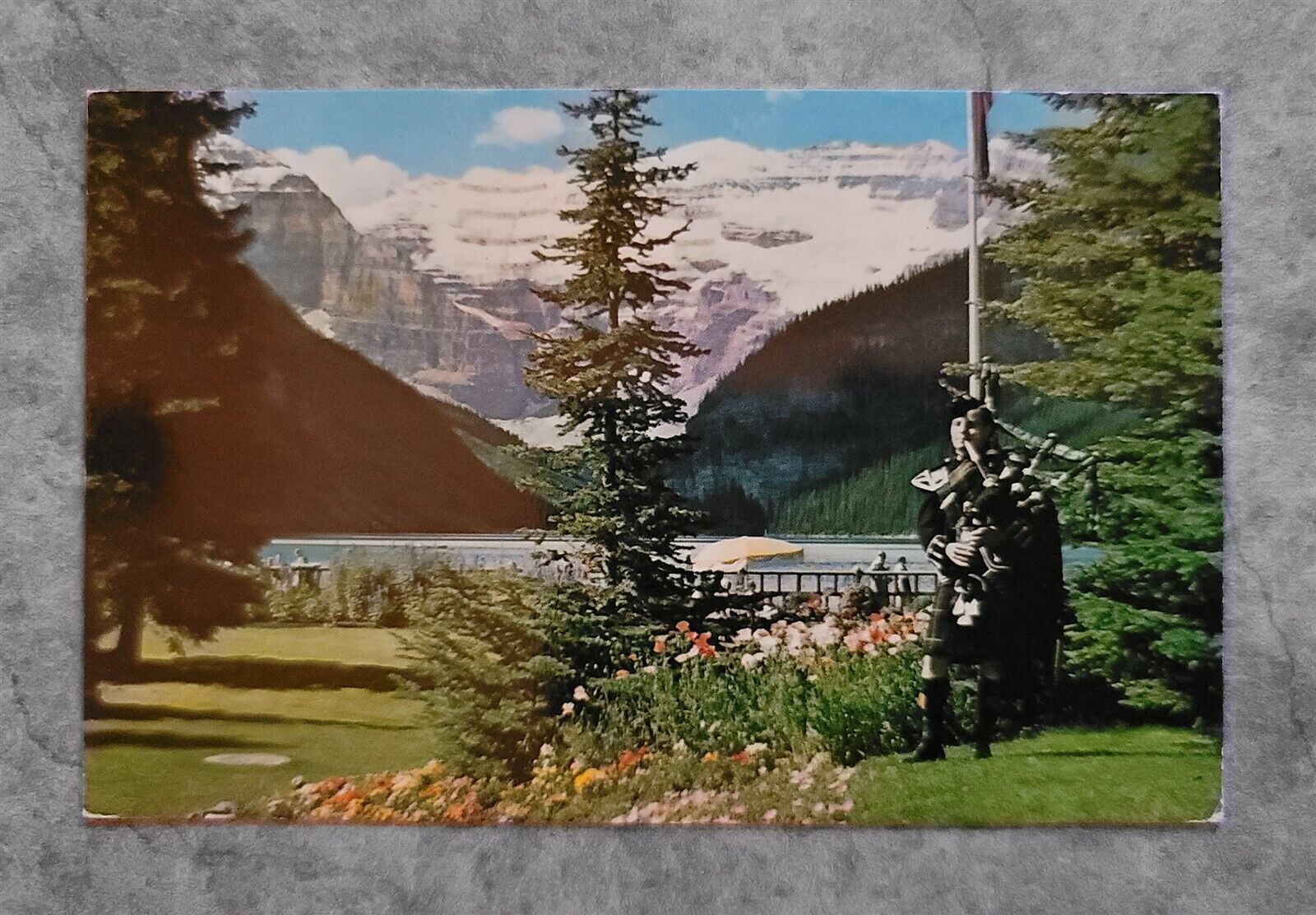c1964 Postcard Banff Canadian Rockies Lake Louise Highland Bagpipes Alberta CA