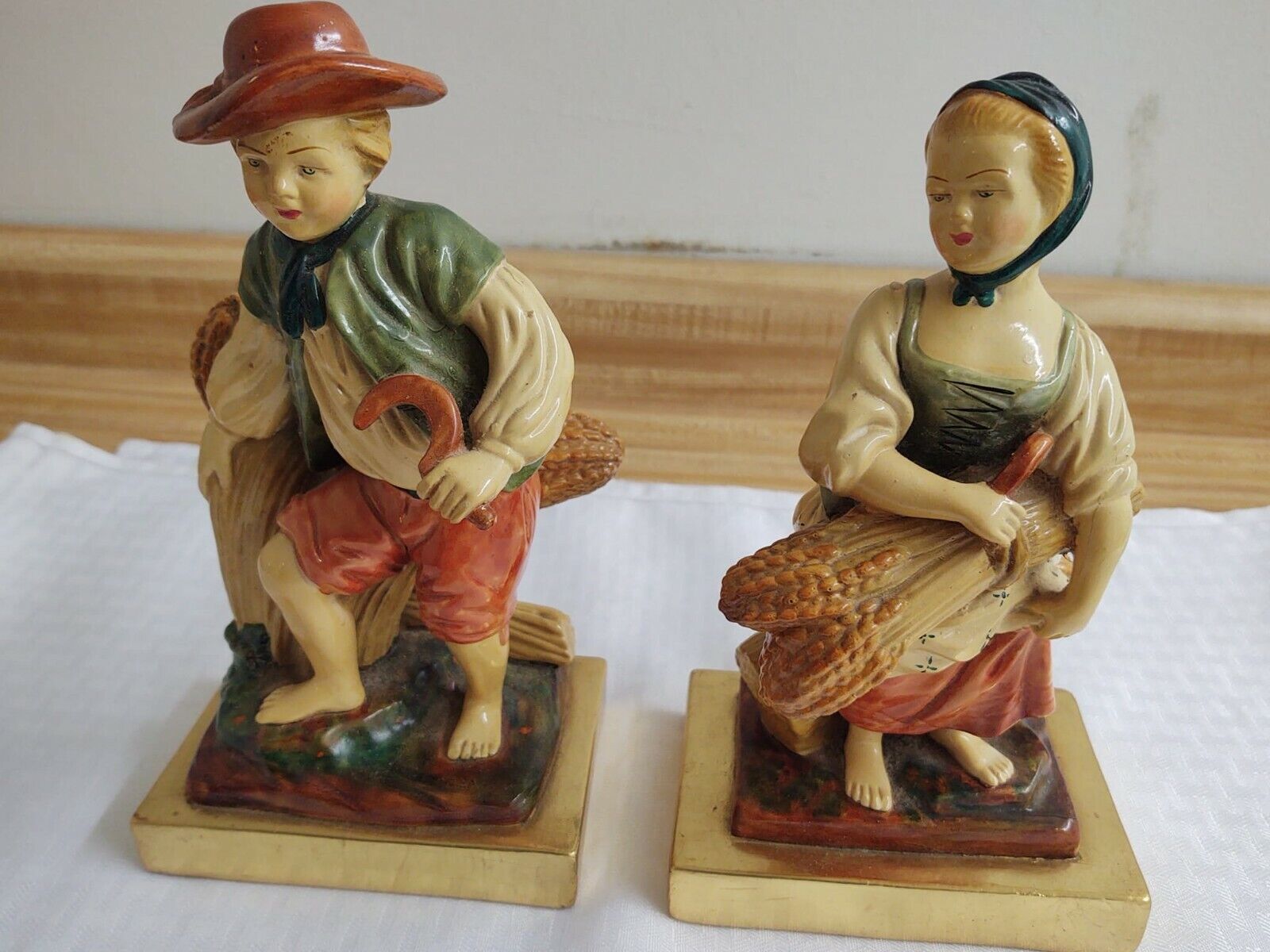 Vintage Country French man/woman figurines; plaster, gold leaf bases.