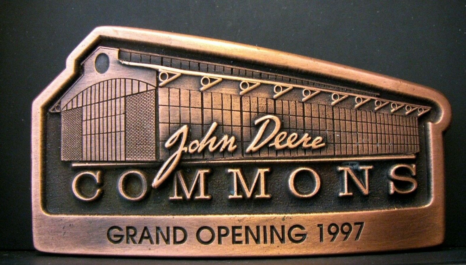 John Deere COMMONS Grand Opening 1997 Copper Colored Belt Buckle jd 1968 Logo