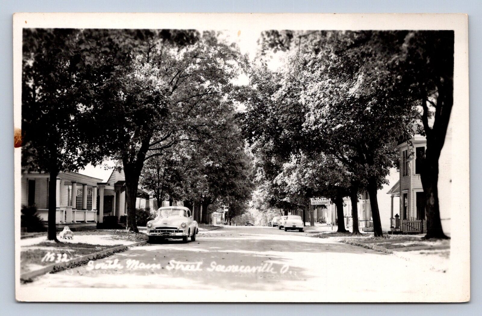 J87/ Senecaville Ohio RPPC Postcard c1940s Cambridge Main St Homes 1728
