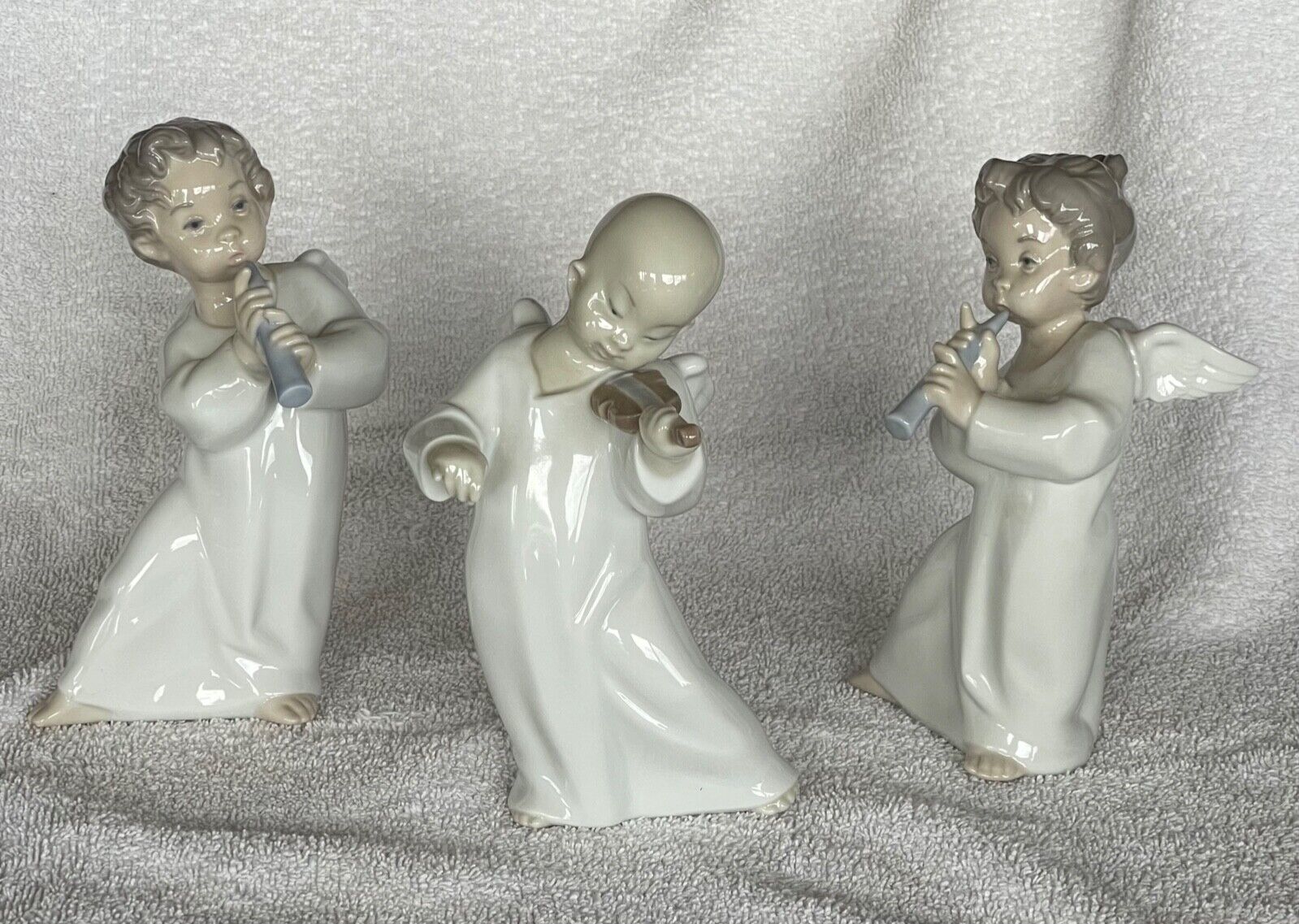 Three musical Llardro children figurines