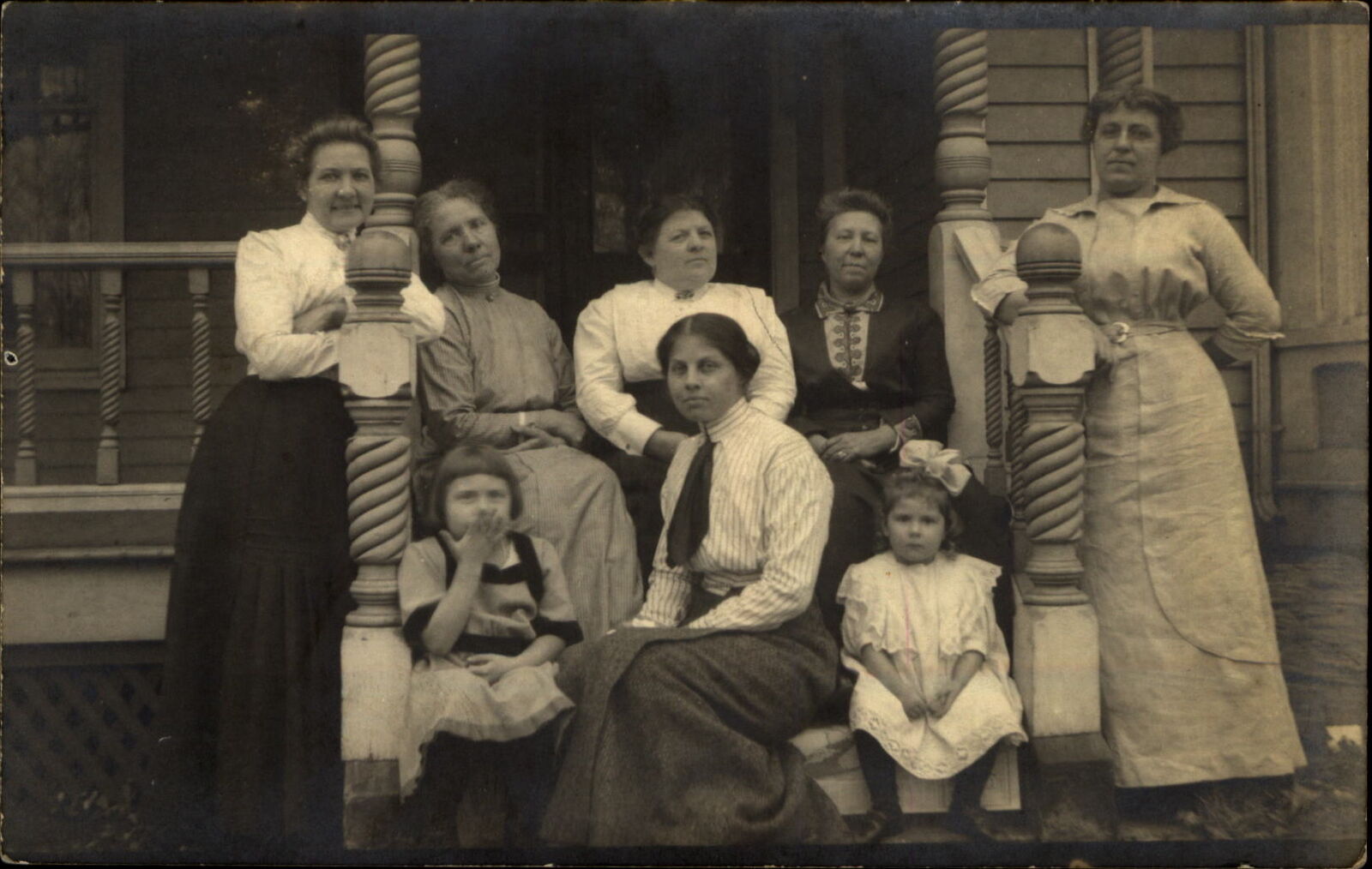 RPPC ~ family? Four generations of women girls on porch~twist carved poles c1910