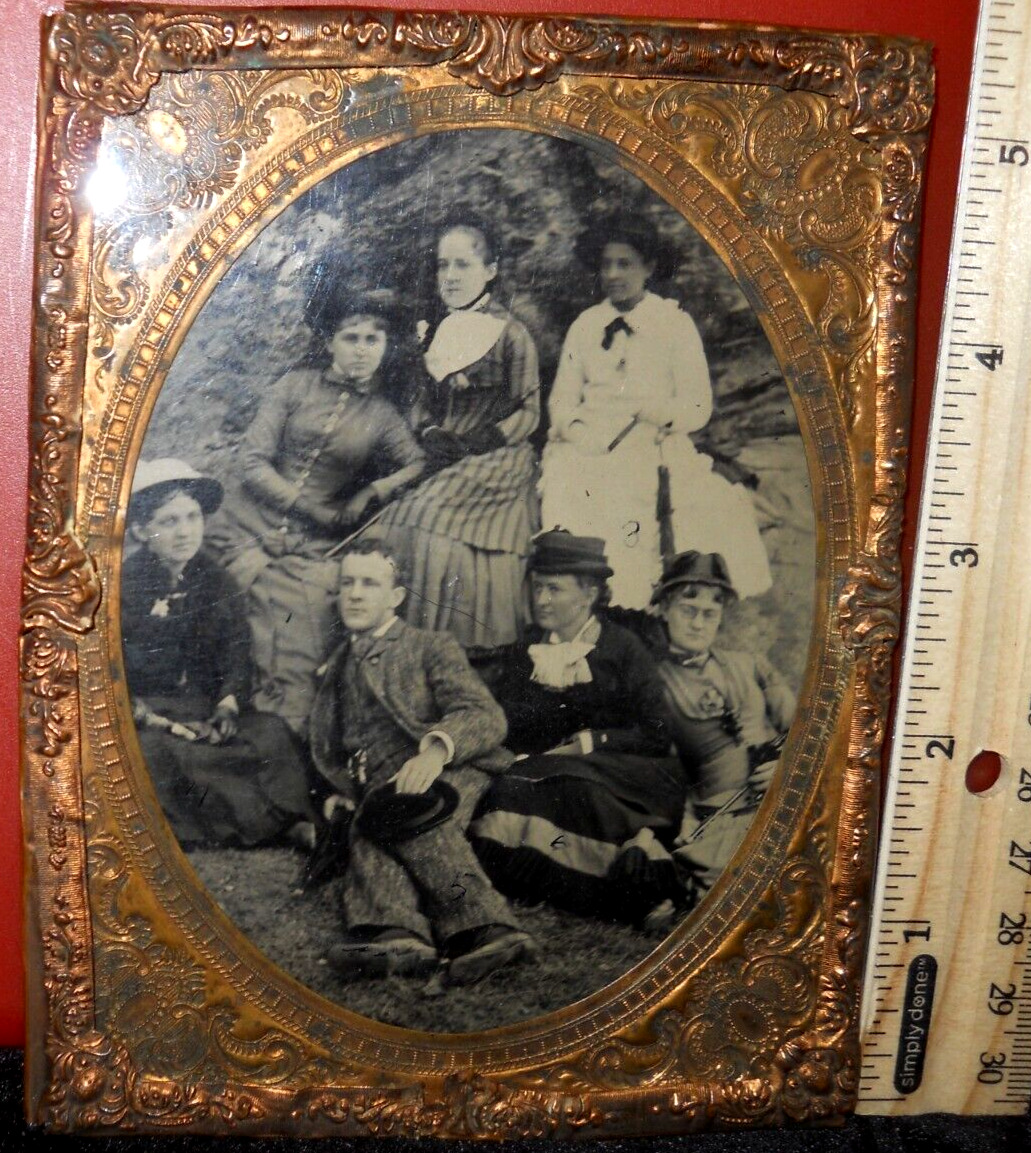 Half plate size Tintype of man and six ladies in brass mat/frame/cover glass