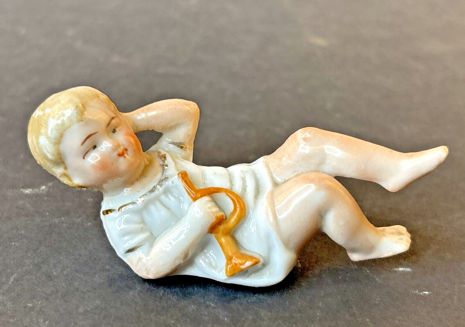 Antique German Porcelain Child Baby Figurine Laying Down with Horn Small 3\