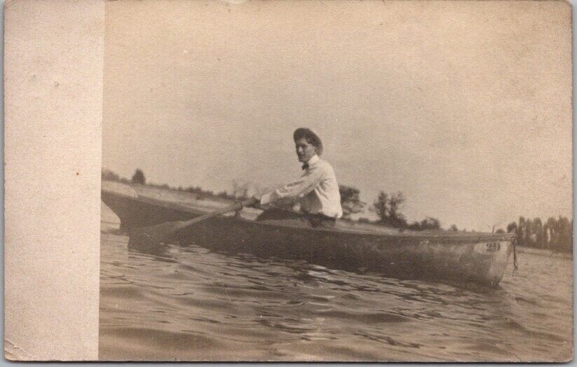 c1910s Real Photo RPPC Postcard Lake Boating Scene / Young Man in Row Boat