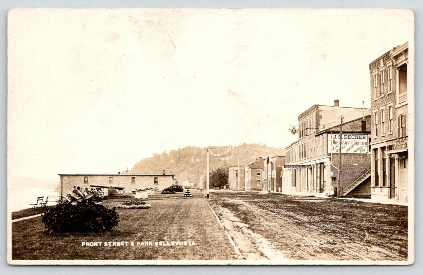 Bellevue Iowa~Front Street~JS Becker Insurance~Masonic Building~Park~c1915 RPPC
