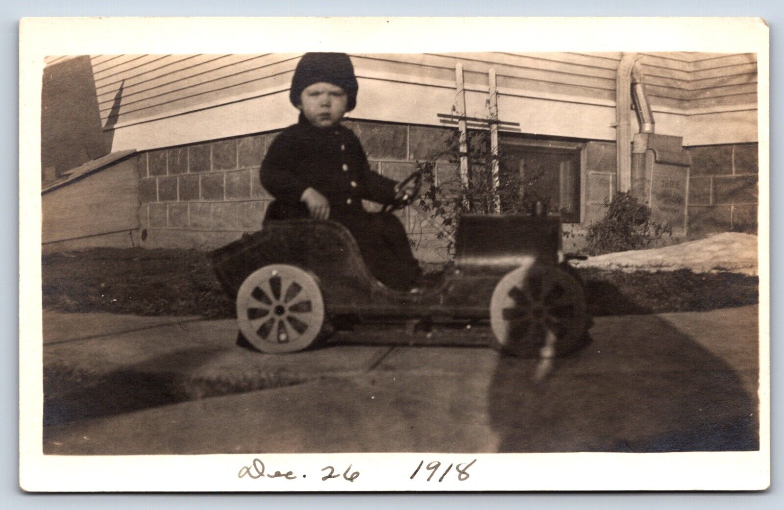 Postcard RPPC Cute Little Boy Beanie Riding Peddle Vintage Toy Cart Sidewalk C4