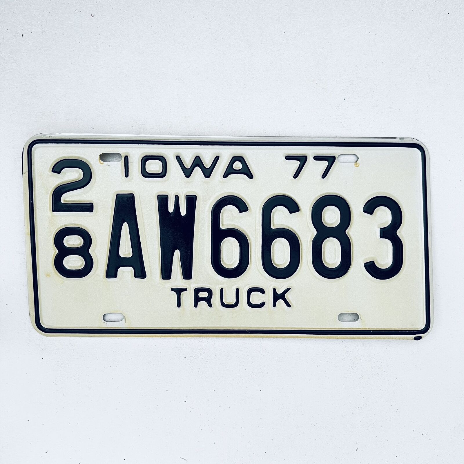 1977 United States Iowa Delaware County Passenger License Plate 28 AW6683