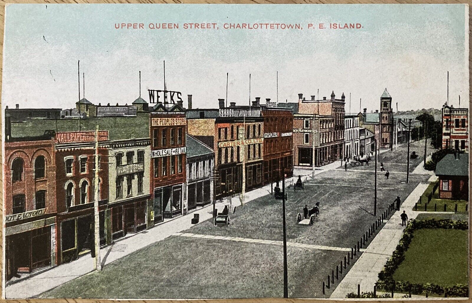 CHARLOTTETOWN, P.E. ISLAND,C.1910 P.C.(A68)~VIEW OF UPPER QUEEN ST. STORE FRONTS