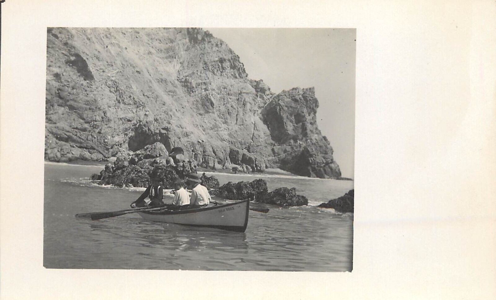 c1907 RPPC: People in Gray Bros. Rowboat, Catalina Island, Shore near Avalon CA