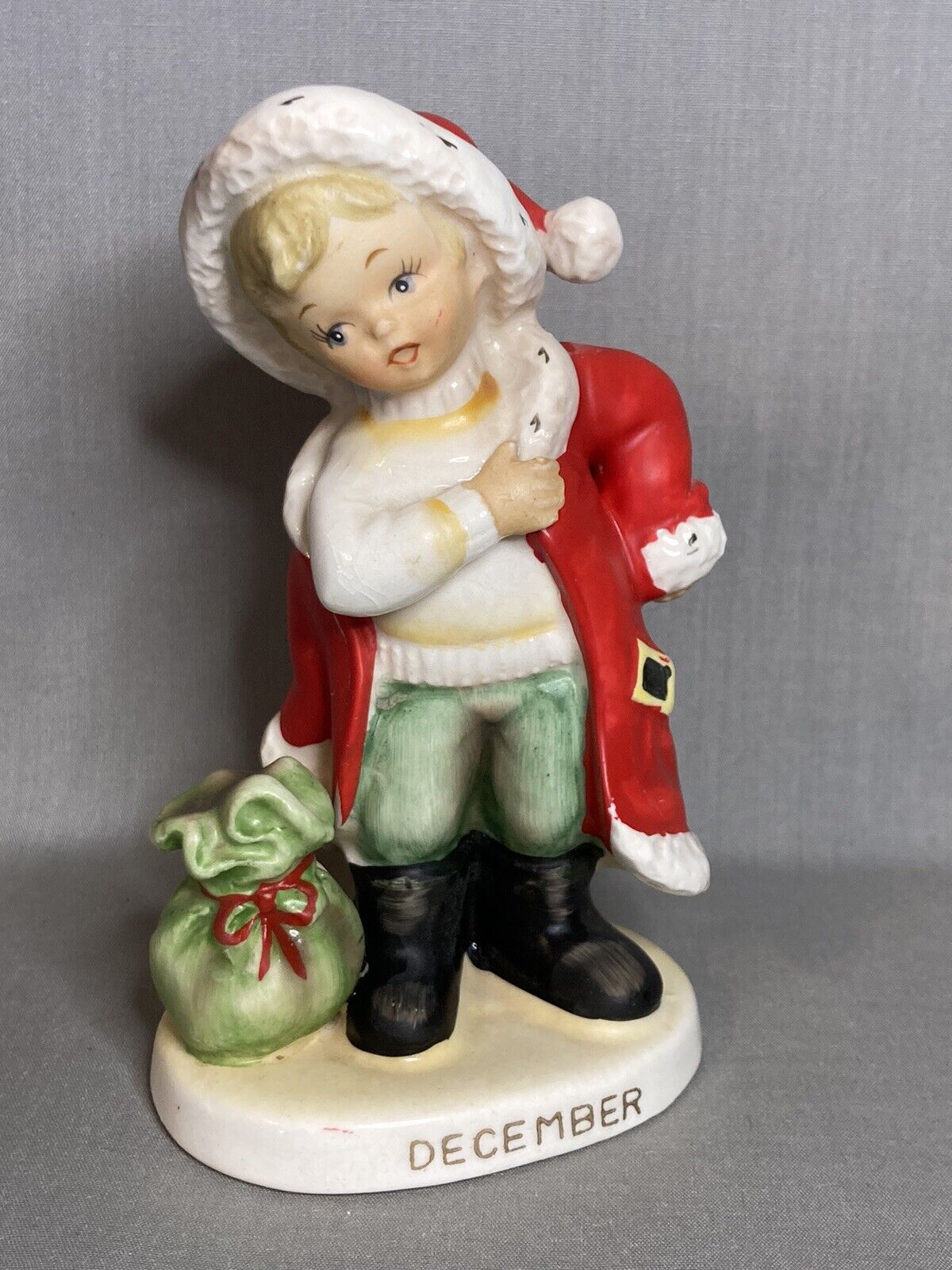 Vintage Lefton December Boy Putting On Santa Suit Figurine Hand-Painted #2300
