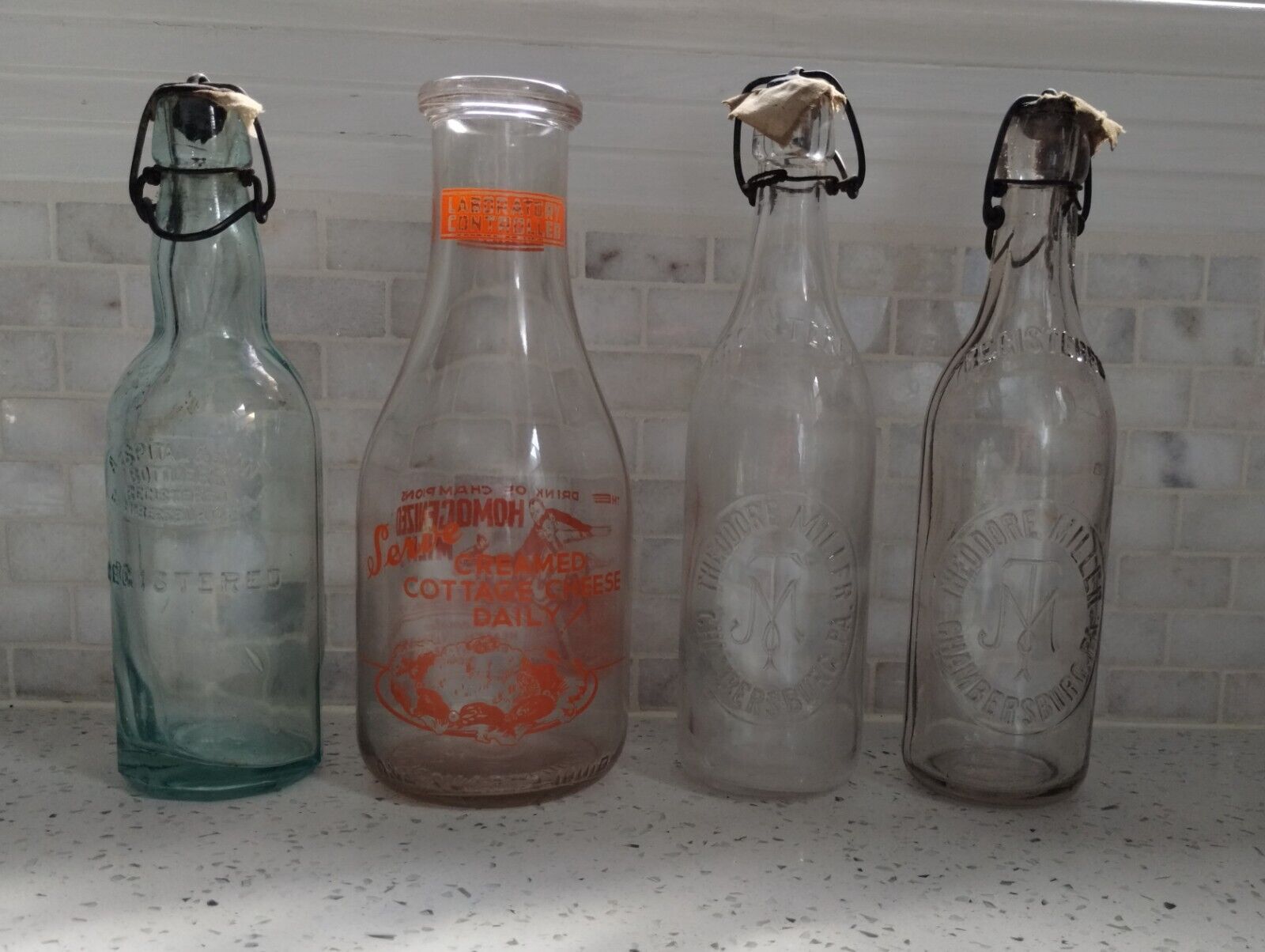 Four Old Bottles:  THEODORE MILLER, A. Spital & Son, Laboratory controlled the d