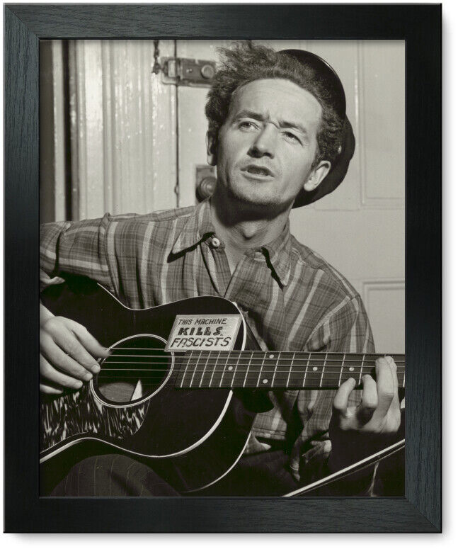 Framed Print: Woody Guthrie, Facing Slightly Left, Holding Guitar, 1943