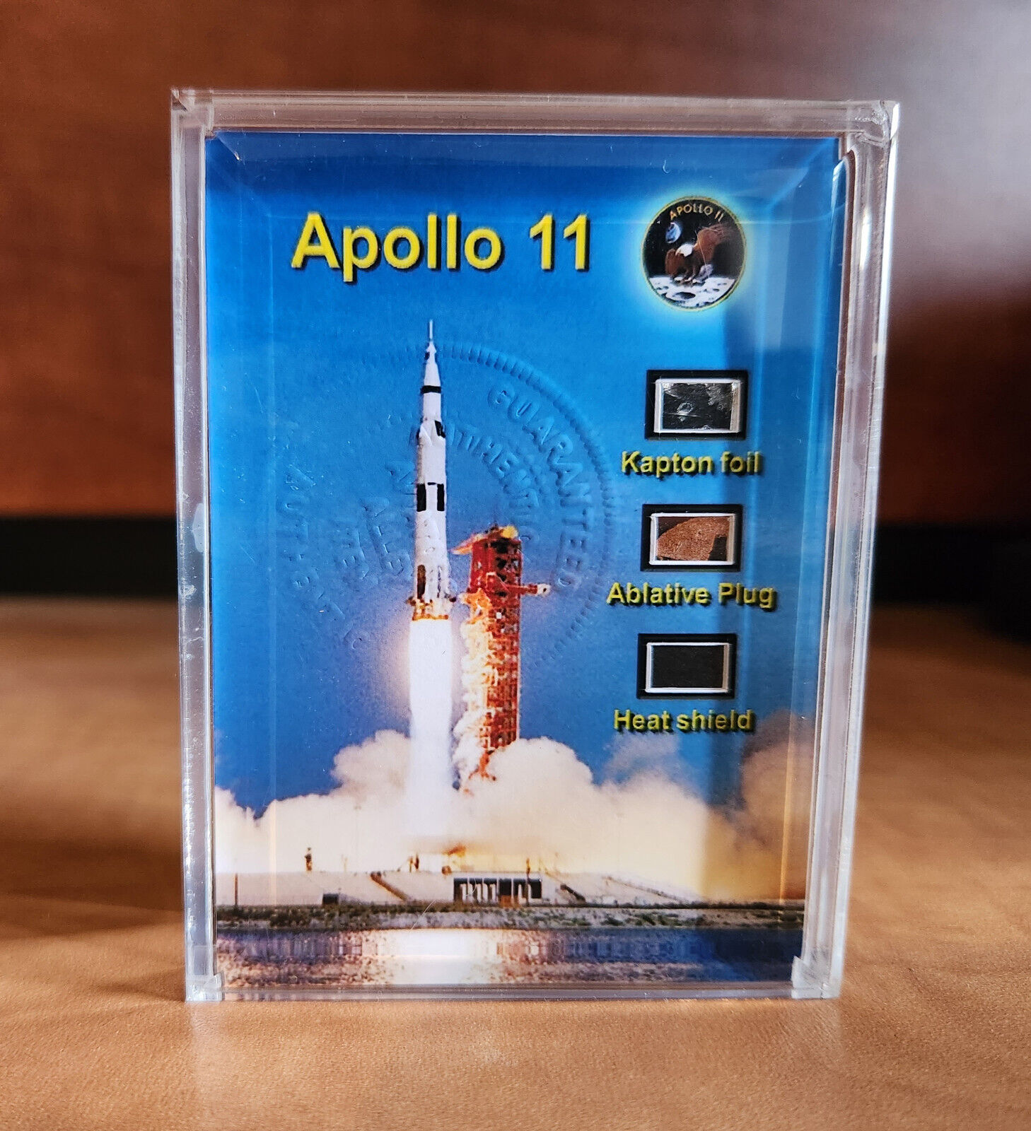 Pieces of Apollo 11 flown kapton foil, abrasive plug, heat shield display
