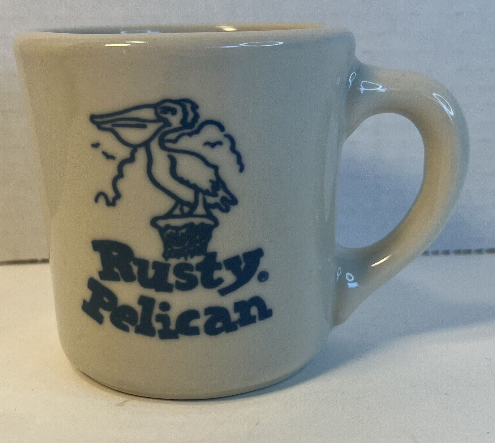 Vintage Rusty Pelican Blue Logo Restaurant Thick Diner Coffee Mug Made USA