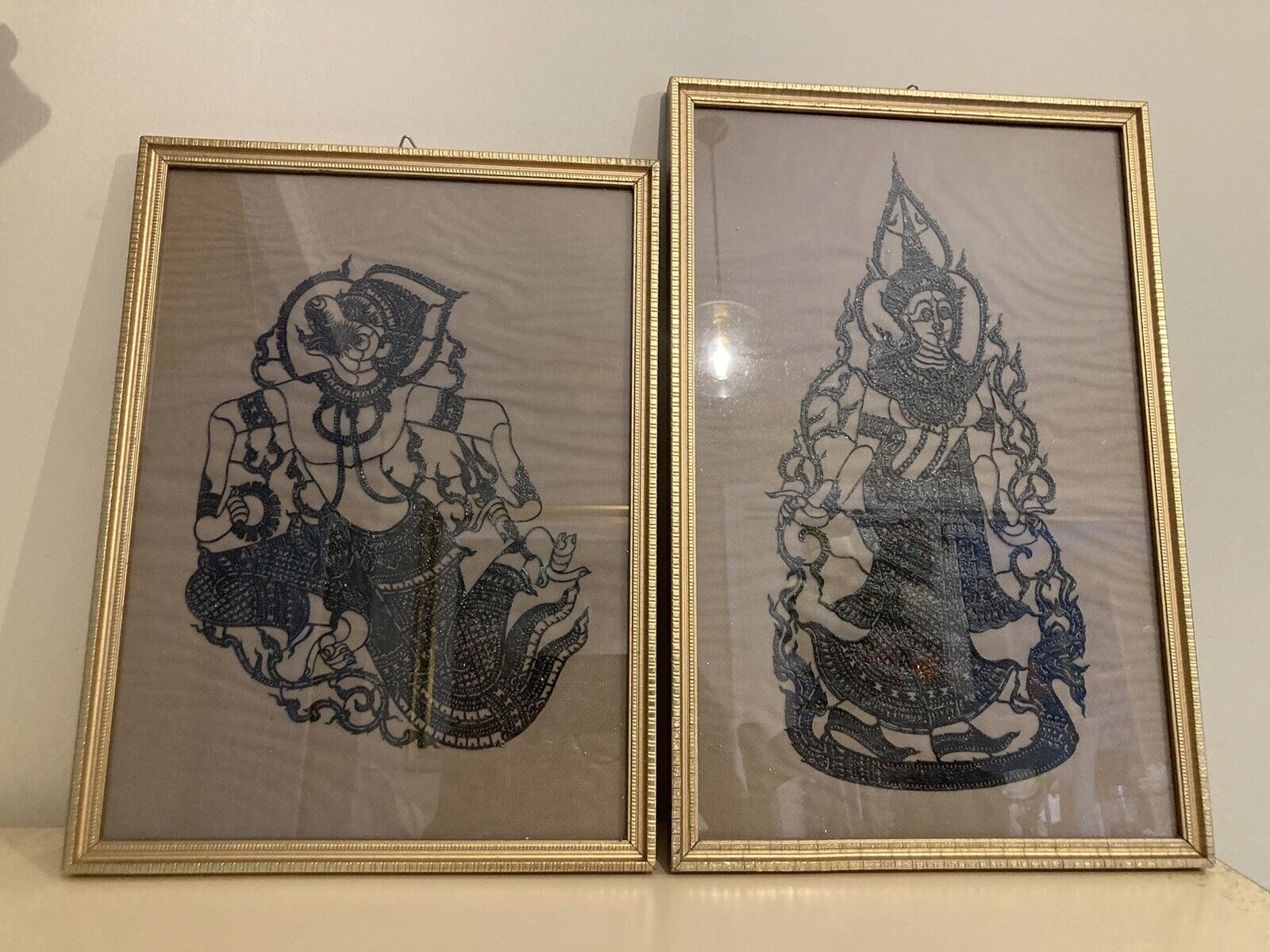 A Pair Of Gold Framed Scherenschnitte Papercut Indian God Silhouettes
