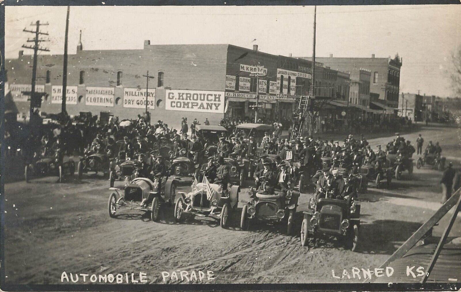 RARE 1909 AUTOMOBILE car Parade LARNED Kansas photo postcard RPPC signage street