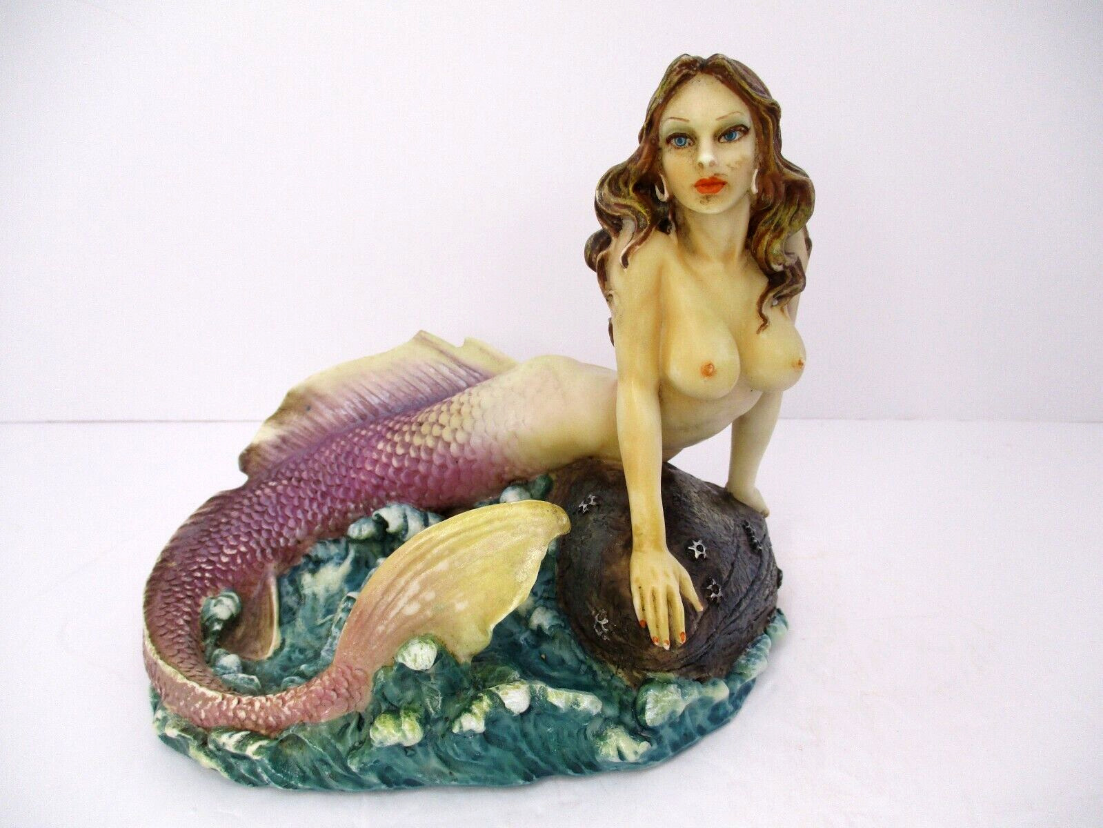 Vintage Mermaid Sitting on a Rock in the Ocean by Summitt Collection