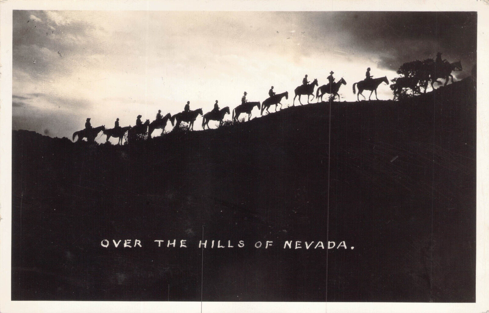 RPPC Cowboys & Horses Over the Hills of Nevada Postcard Red Cross Roll Call Join