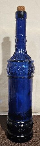 Decorative Cobalt Blue Glass Bottle with abstract flower cross motif Retro Look