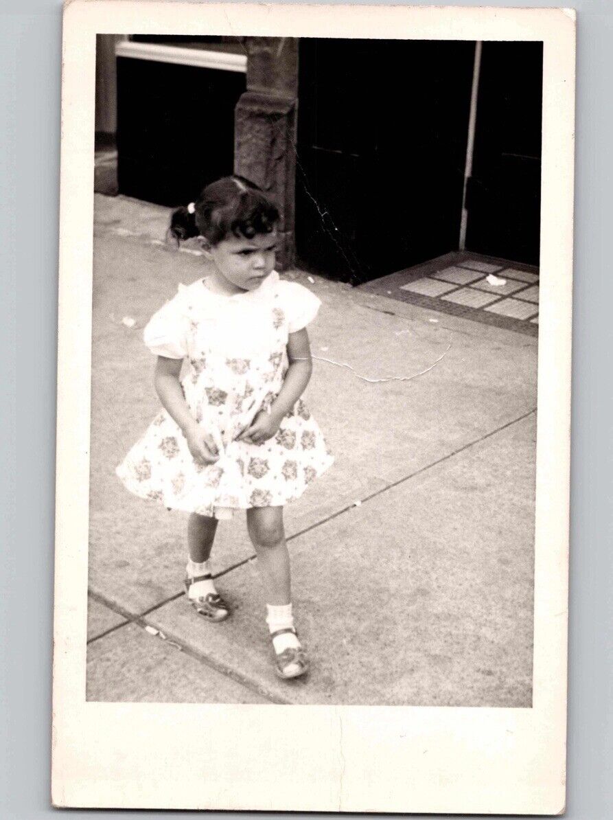 c1952 Cute Little Girl Walking Floral Dress Elyria OH RPPC Real Photo Postcard
