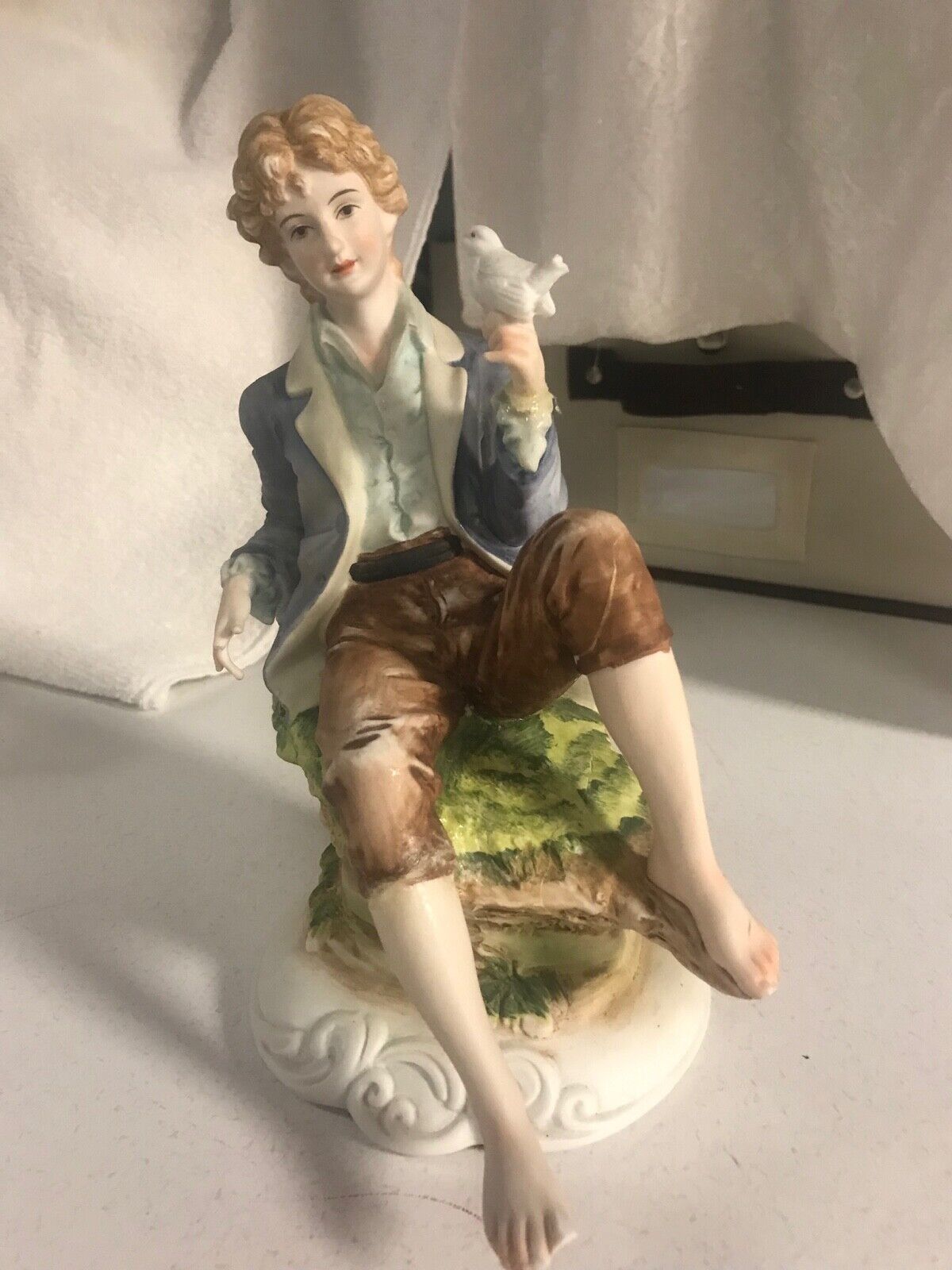 vintage porcelain figurine by Felton over 75 yrs  used sat in curio
