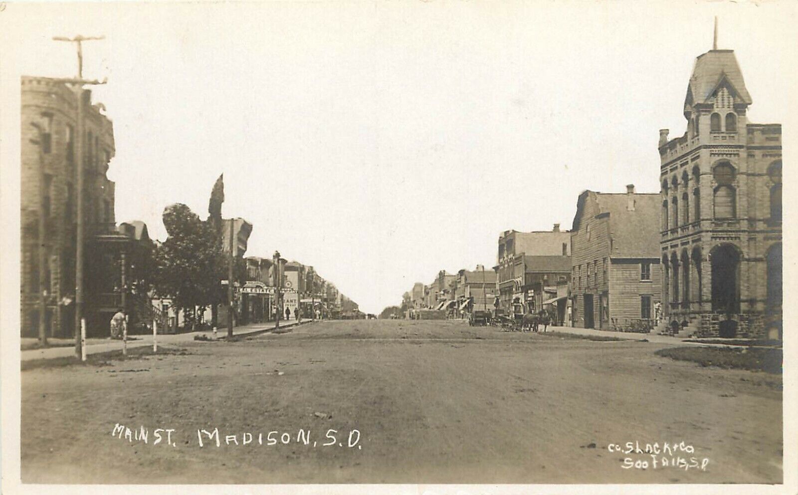 c1910 RPPC Main Street Scene, Madison SD Lake County, Slack & Co. Photo