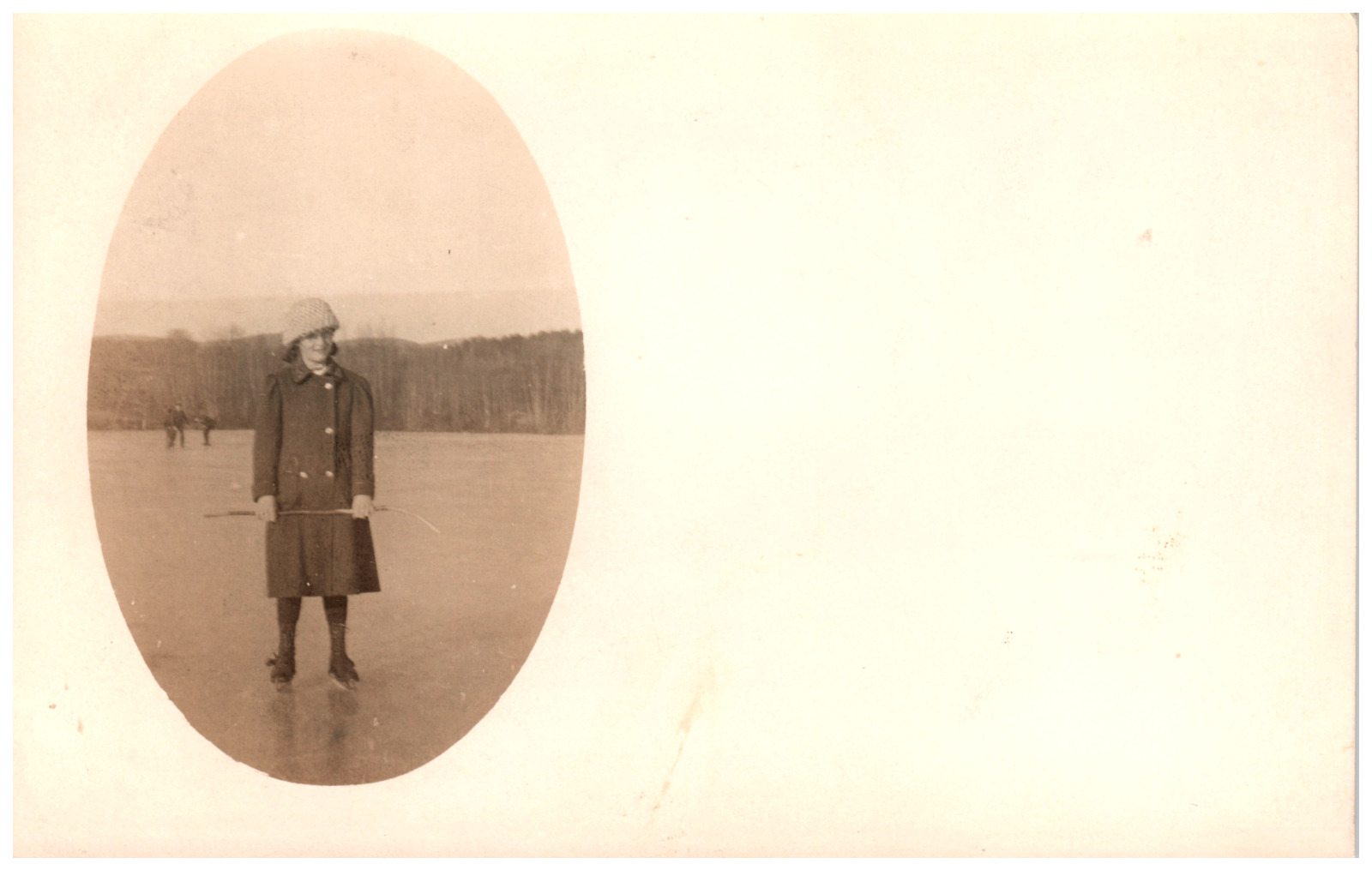 Postcard Vintage RPPC Woman Standing on a Frozen Lake