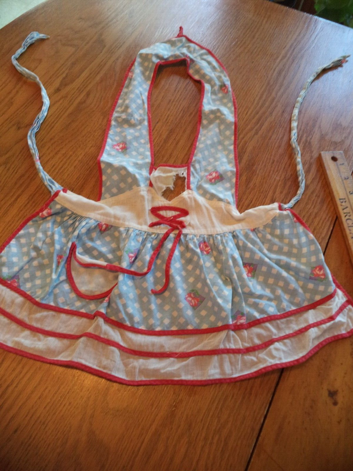 Vintage 1960s small girl\'s Apron with red trim blue and white check fabric