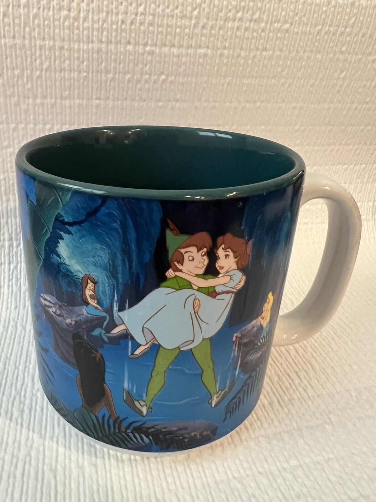 Walt Disney\'s Peter Pan Coffee Mug featuring Peter and Wendy in Neverland
