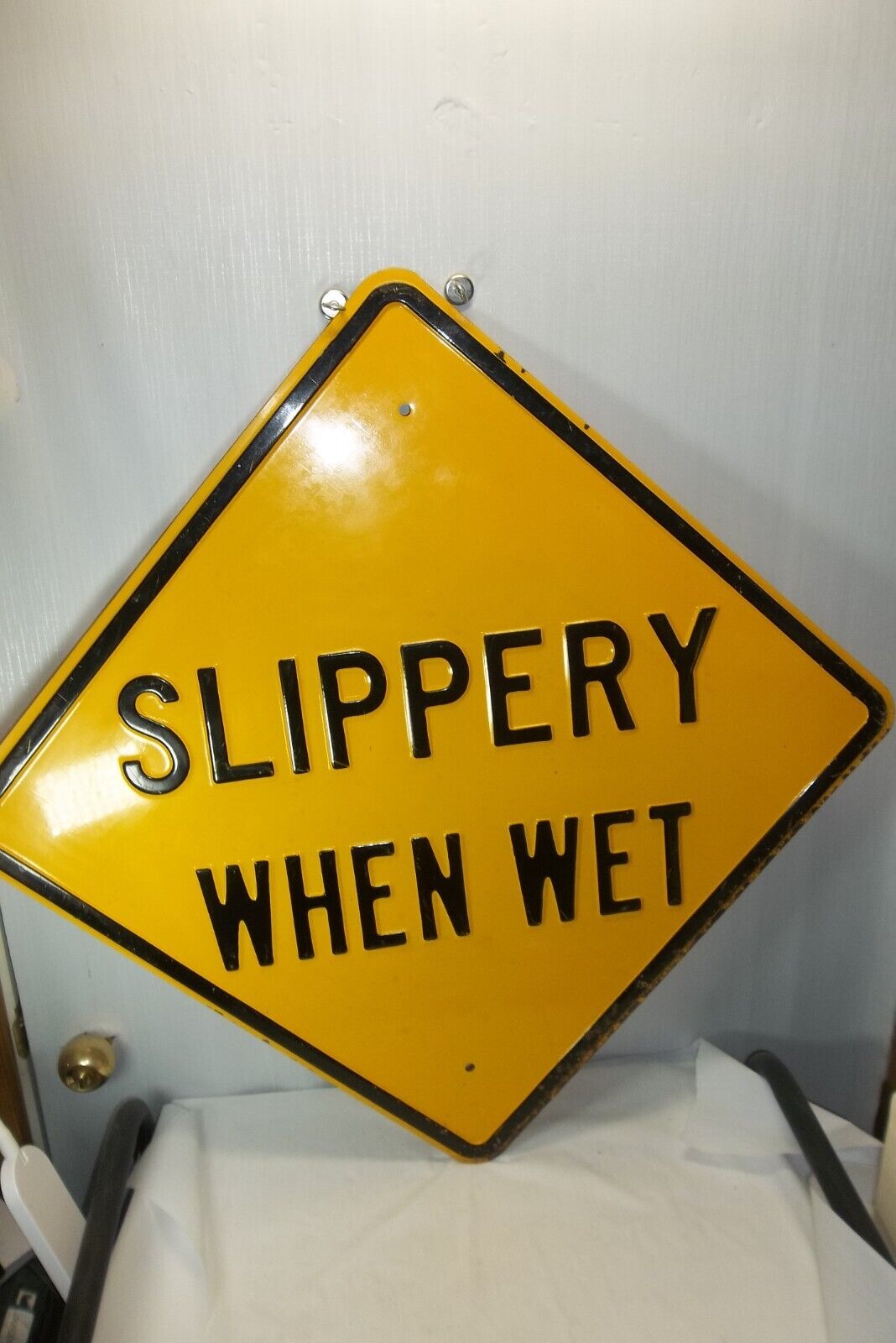 Vintage N.O.S Slippery when wet steel embossed sign 24\
