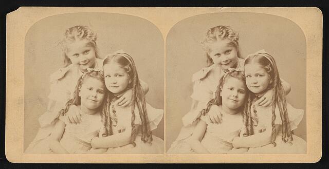 Photo:Three girls embracing and smiling