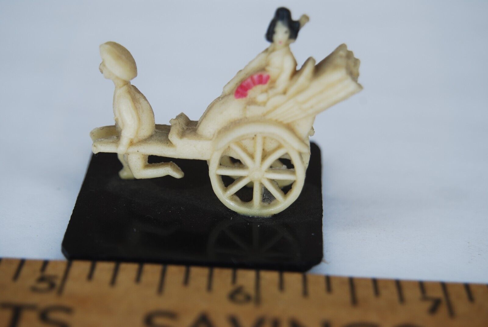 Antique Ivory Colored plastic Rickshaw figure with passenger on base, 1-1/2 inch