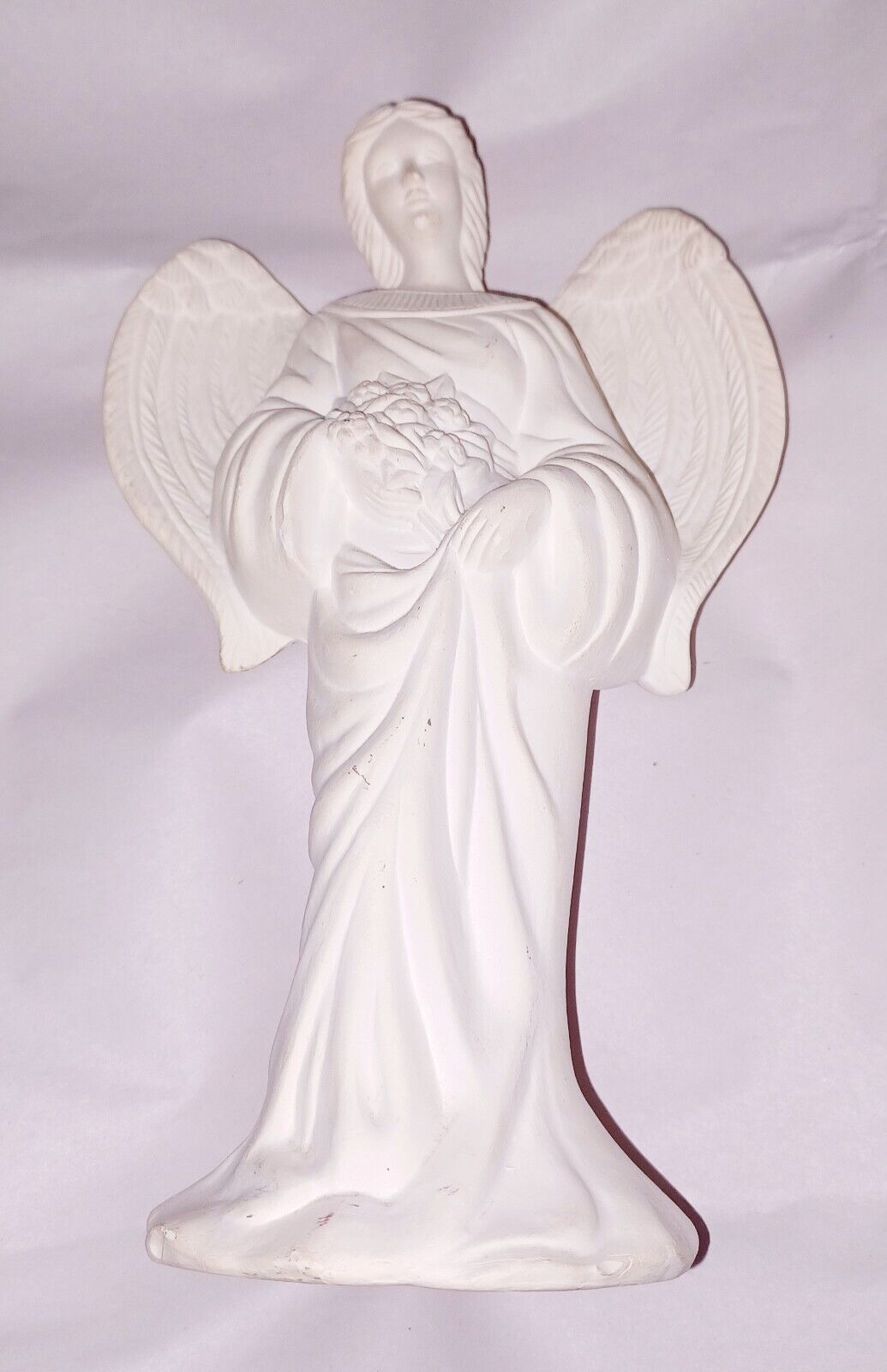 Unpainted Ceramic Angel. 7.5 Inches Tall.