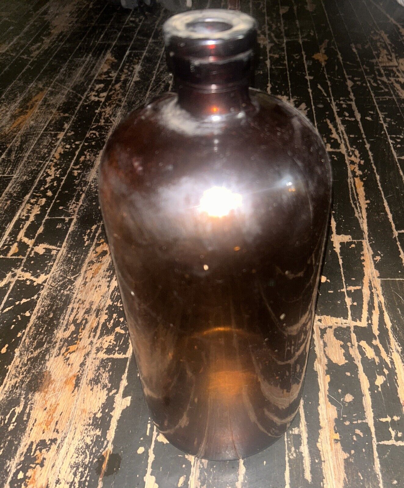 large antique glass bottle