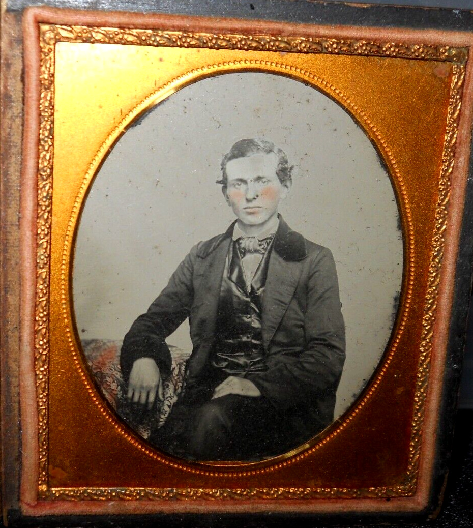 1/6th size tinted Ambrotype of young man in half case