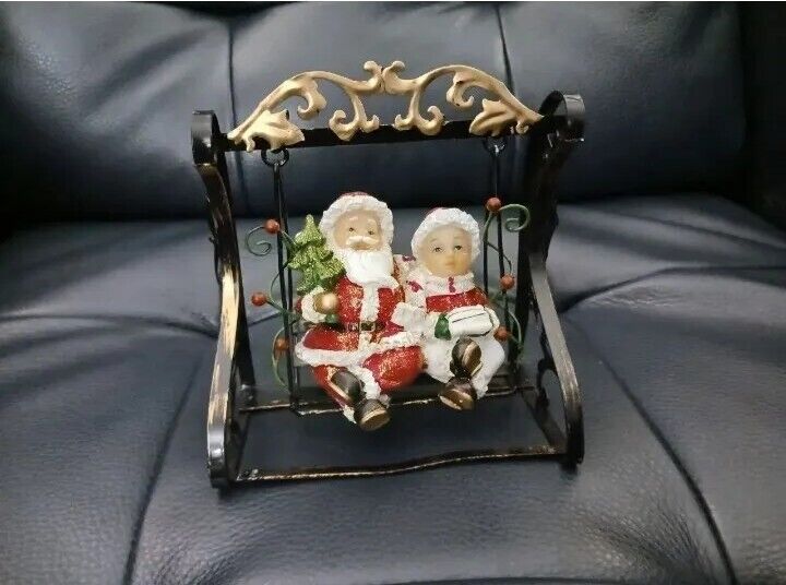 Adorable Mr. & Mrs. Santa Claus on a swing that really moves Christmas Figurine 