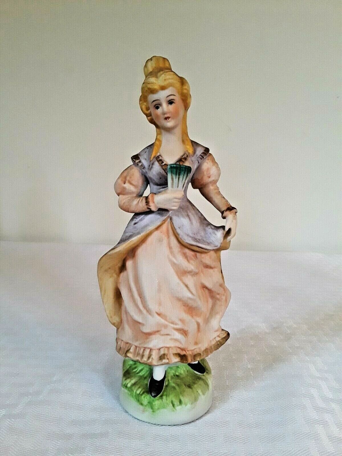 Rare Vintage Porcelain Figurine Woman with pink purple flowing dress holding Fan