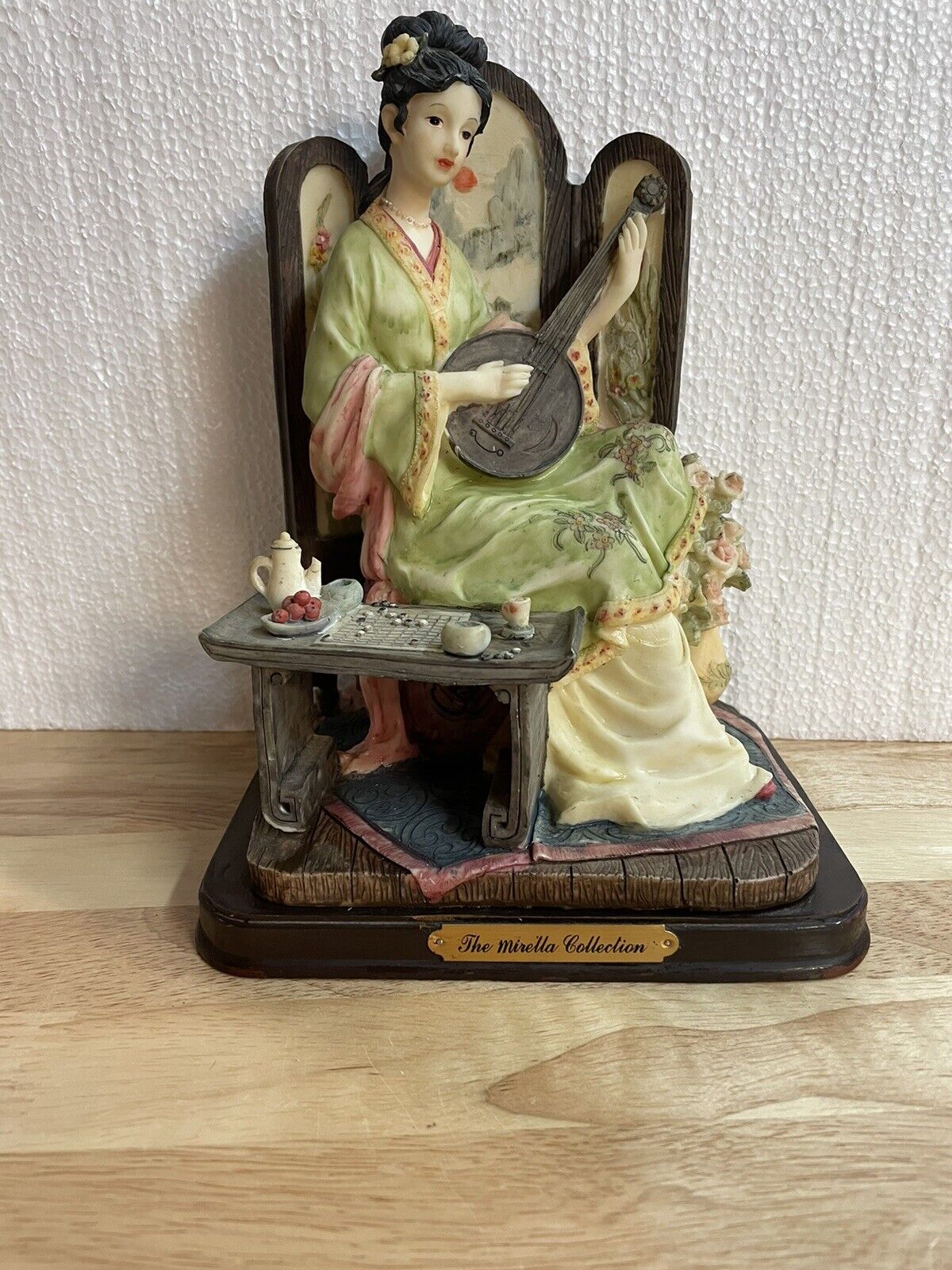 the mirella collection Woman With Musical Instrument ,Table, Roses On Wood Base.