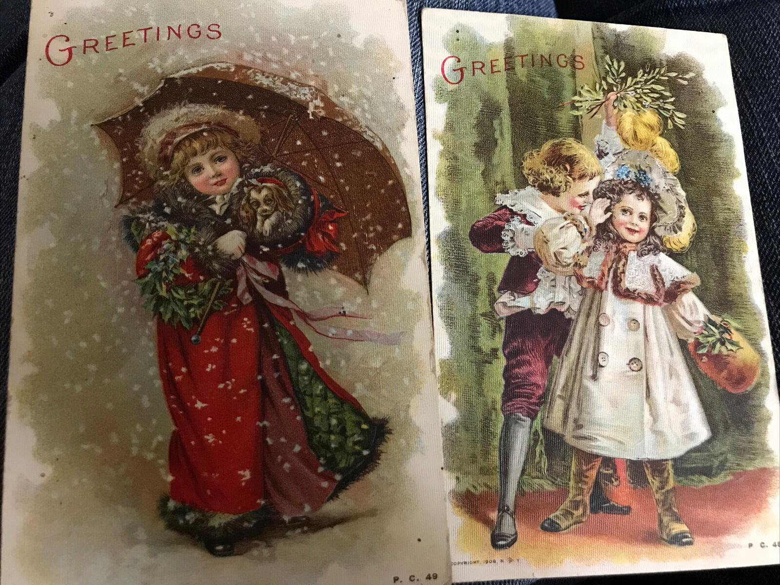 Antique Christmas 2 Postcard Children Boy Girl Mistletoe White Coat Red Coat Umb