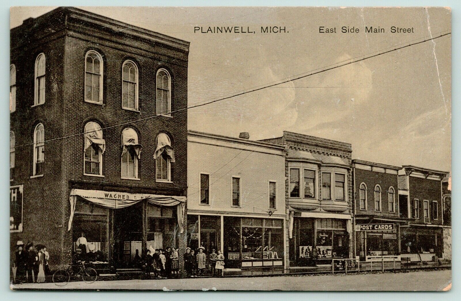Plainwell MI~E Side Main St~Kids Loaf @ Wagner & ? Store~Post Card Shop~c1910